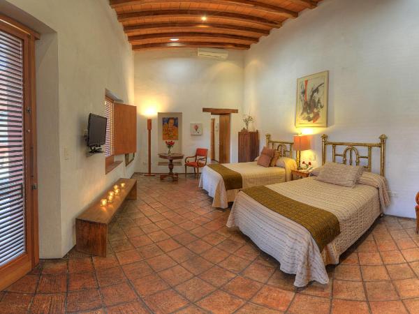 Hotel La Casona de Tita : photo 1 de la chambre chambre deluxe avec 2 lits doubles