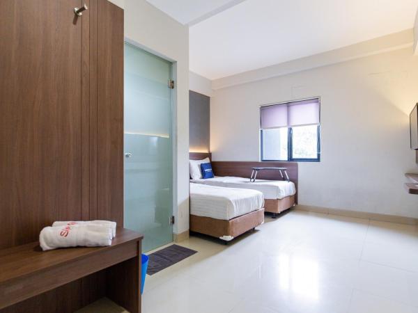 Urbanview Hotel Slipi Inn Palmerah : photo 3 de la chambre chambre lits jumeaux supérieure