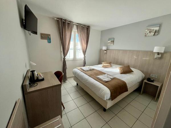 Hôtel Les Arcades : photo 3 de la chambre chambre double standard – rez-de-chaussée