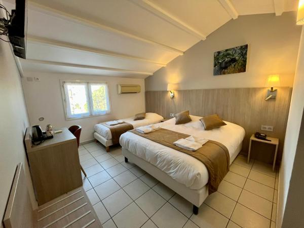 Hôtel Les Arcades : photo 3 de la chambre chambre triple standard