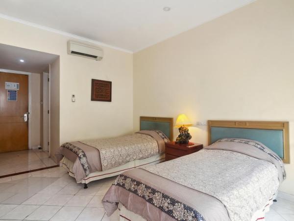 Puri Sawo Manila Residence : photo 3 de la chambre chambre lits jumeaux spacieuse