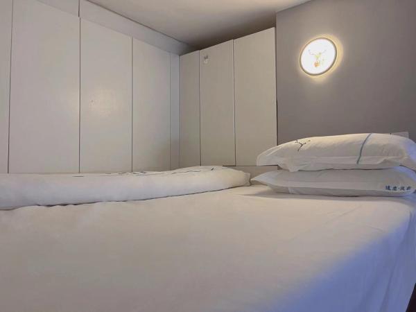 广州沃家国际公寓 : photo 7 de la chambre studio duplex