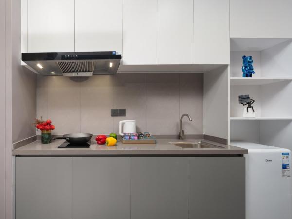 Yutai Hotel Apartment : photo 4 de la chambre chambre lits jumeaux deluxe