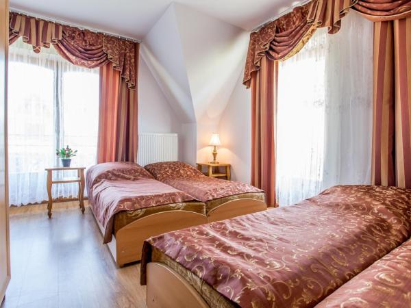 Pod Modrzewiami : photo 1 de la chambre chambre quadruple