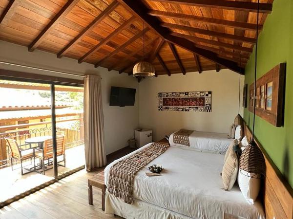 Pousada Villa Canaã : photo 9 de la chambre chambre triple avec balcon