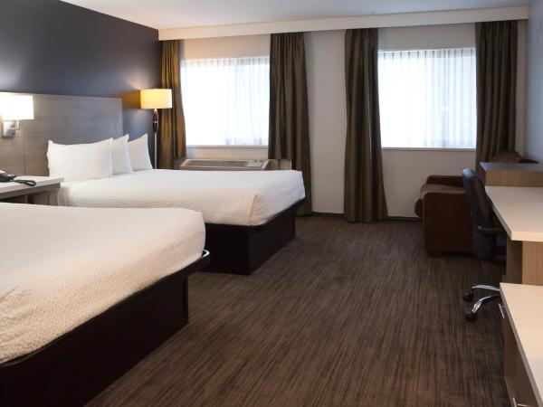 Days Inn by Wyndham Kelowna : photo 2 de la chambre one-bedroom queen suite with courtyard view - non-smoking