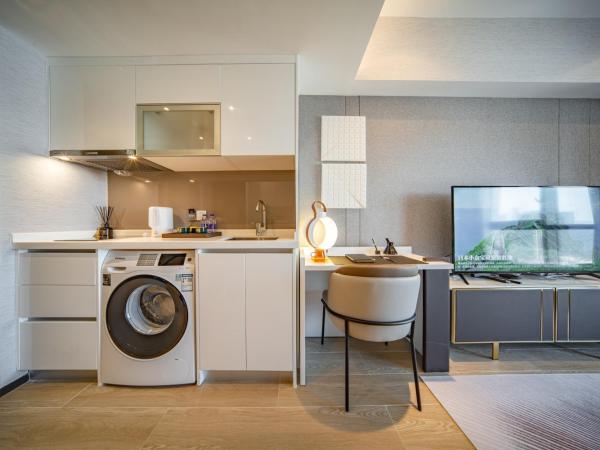 BORUISI Executive Apartment : photo 4 de la chambre chambre lit king-size deluxe