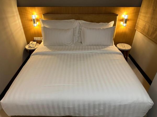 d'primahotel Jemursari Surabaya : photo 3 de la chambre chambre double ou lits jumeaux supérieure