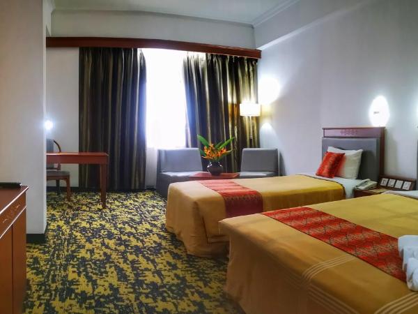 Hotel Grand Continental Kuching : photo 10 de la chambre chambre familiale deluxe