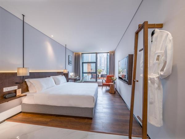 Wuyu Hotel - Chongqing Jiangbei Airport : photo 1 de la chambre chambre double deluxe avec balcon