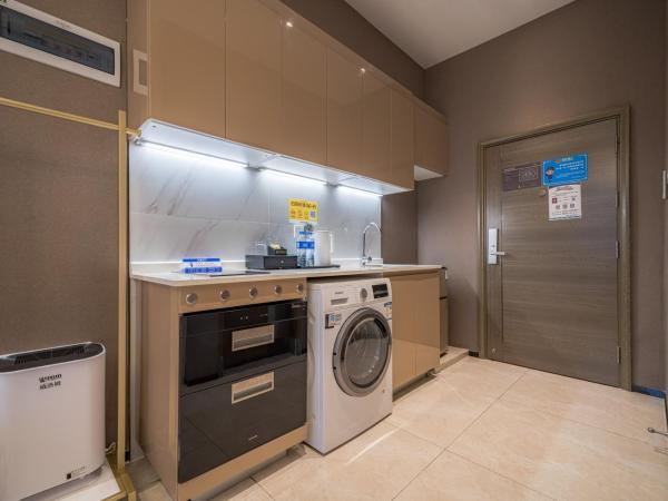 Gepai Executive Apartment - Shenzhen Futian Convention and Exhibition Center : photo 6 de la chambre deluxe executive king room (washing machine + refrigerator)