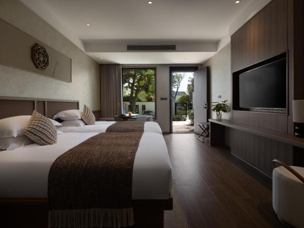 GINLAN JIA RESORT Yuhang Hangzhou : photo 6 de la chambre chambre lit queen-size - vue sur jardin