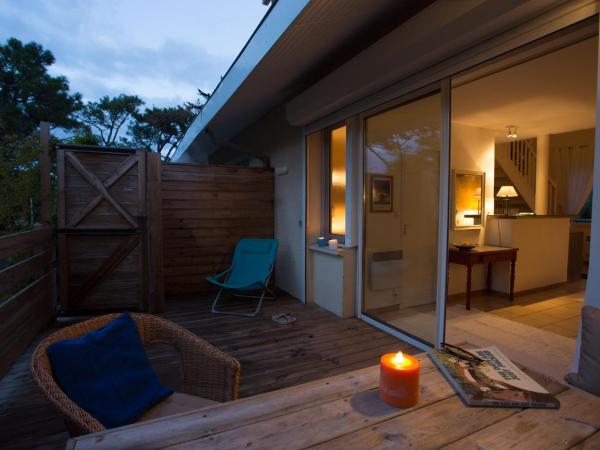 Le Lodge du Cap Ferret : photo 4 de la chambre appartement - vue sur jardin