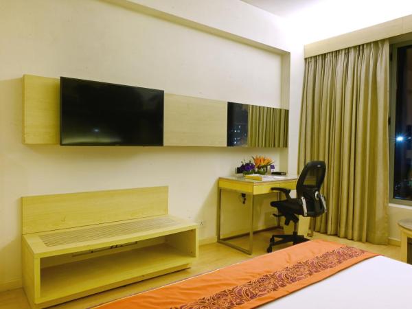 Vivanta Kolkata EM Bypass : photo 4 de la chambre chambre lit king-size deluxe - vue sur ville