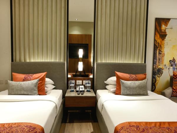 Vivanta Kolkata EM Bypass : photo 2 de la chambre chambre lits jumeaux premium - vue sur ville