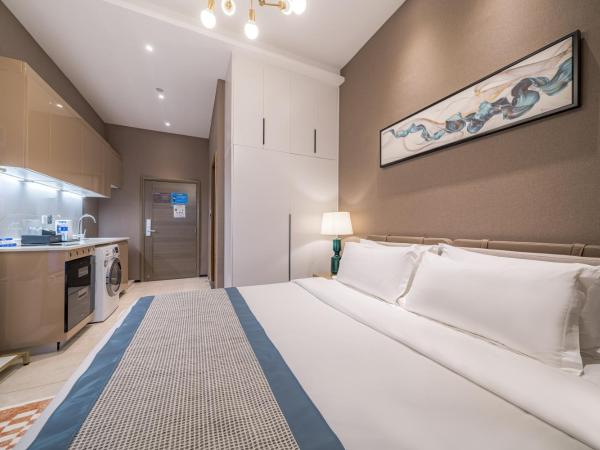 Gepai Executive Apartment - Shenzhen Futian Convention and Exhibition Center : photo 2 de la chambre deluxe executive king room (washing machine + refrigerator)