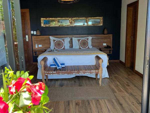 Pousada Villa Canaã : photo 4 de la chambre suite lit king-size avec baignoire spa