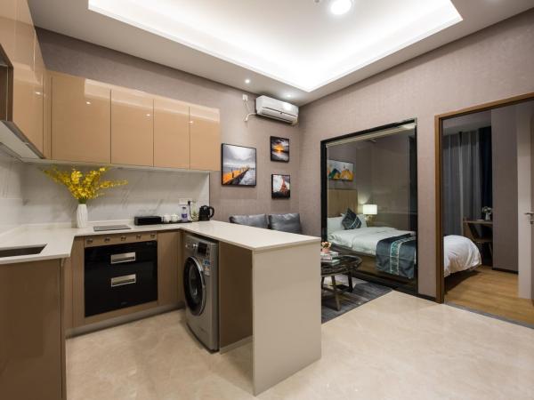 Gepai Executive Apartment - Shenzhen Futian Convention and Exhibition Center : photo 1 de la chambre one bedroom (washing machine + refrigerator)