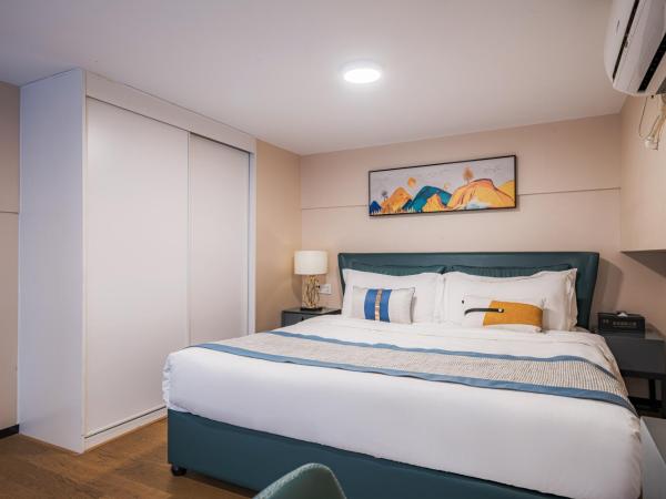 Gepai Executive Apartment - Shenzhen Futian Convention and Exhibition Center : photo 5 de la chambre deluxe loft king room (drying washer + refrigerator)