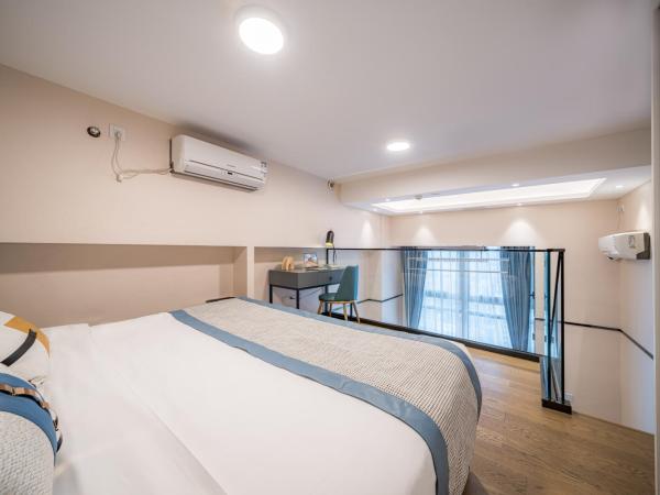 Gepai Executive Apartment - Shenzhen Futian Convention and Exhibition Center : photo 6 de la chambre deluxe loft king room (drying washer + refrigerator)