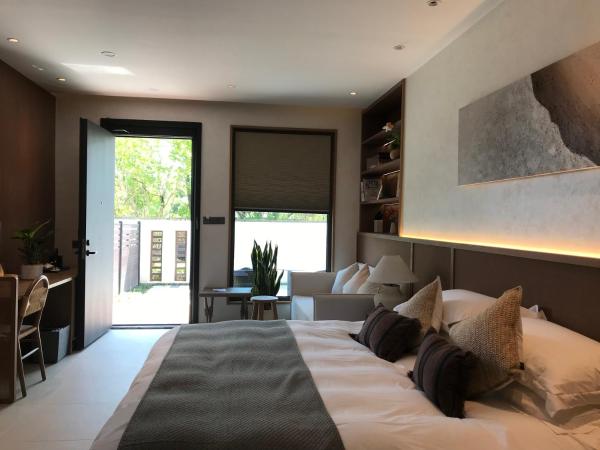 GINLAN JIA RESORT Yuhang Hangzhou : photo 2 de la chambre chambre lit queen-size - vue sur jardin