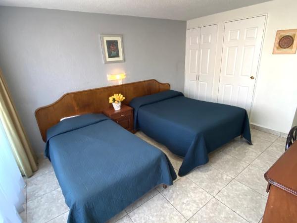 Hotel Qualitel Plus : photo 8 de la chambre chambre avec 2 lits doubles