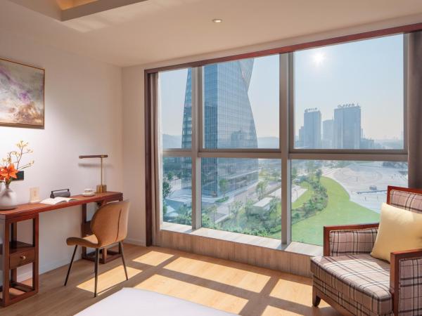 Xunguang Hotel - Chongqing Liangjiang Happiness Plaza : photo 2 de la chambre chambre lits jumeaux deluxe