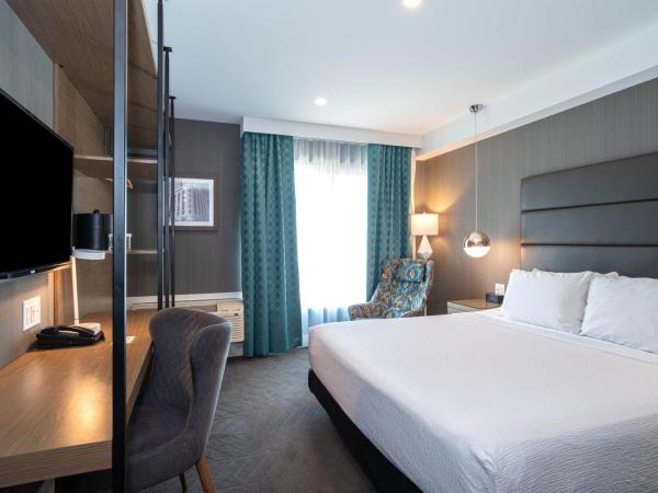 Sandman Signature Calgary Airport Hotel : photo 1 de la chambre chambre signature lit king-size