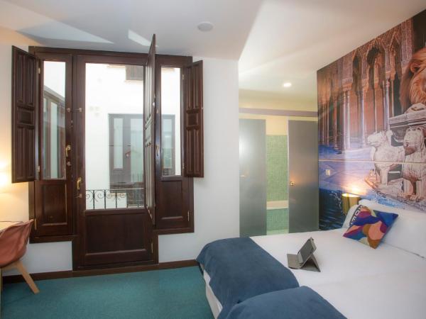 Casual Ilbira Granada : photo 9 de la chambre chambre double ou lits jumeaux