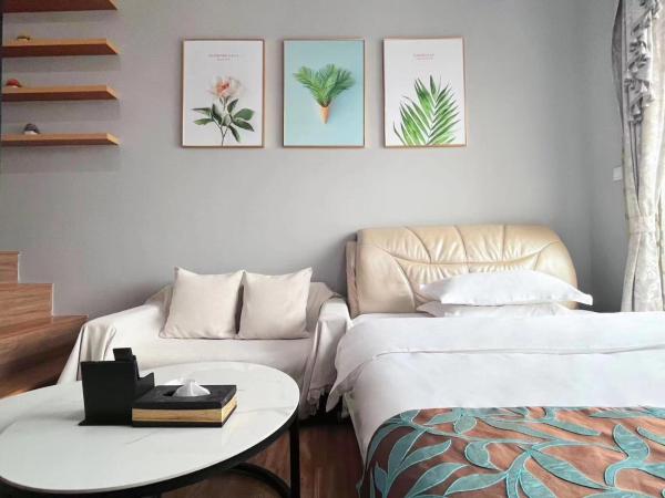 广州沃家国际公寓 : photo 2 de la chambre chambre double ou lits jumeaux deluxe - vue sur rivière