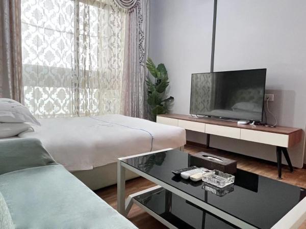 广州沃家国际公寓 : photo 5 de la chambre chambre double ou lits jumeaux deluxe - vue sur ville