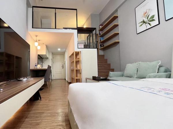 广州沃家国际公寓 : photo 4 de la chambre chambre double ou lits jumeaux deluxe - vue sur ville