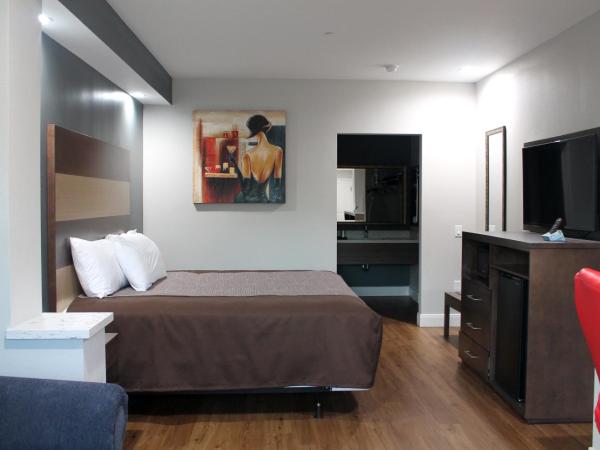 Grand Villa Inn and Suites Westchase/Chinatown : photo 5 de la chambre suite lit king-size