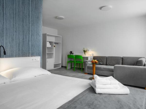 Płonia Resort : photo 3 de la chambre suite supérieure lit king-size