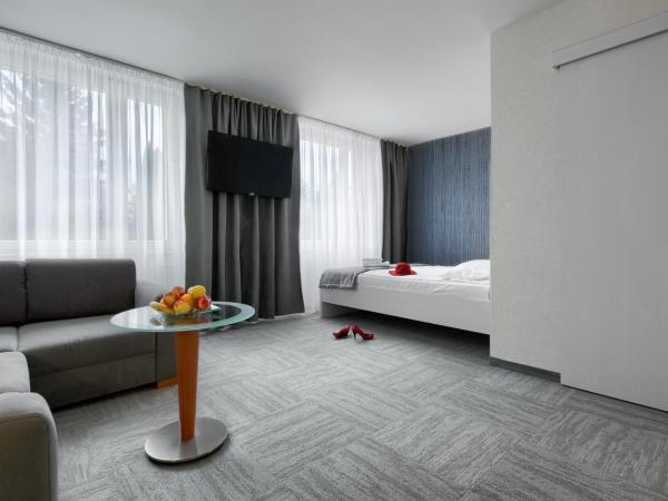 Płonia Resort : photo 1 de la chambre suite supérieure lit king-size