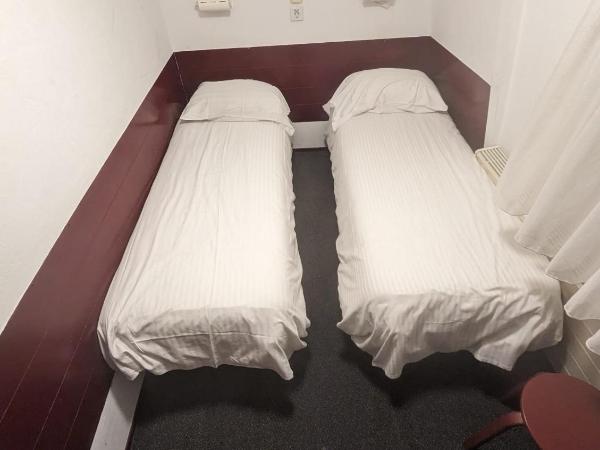 Budget Hotel Ben : photo 1 de la chambre chambre lits jumeaux standard avec salle de bains commune