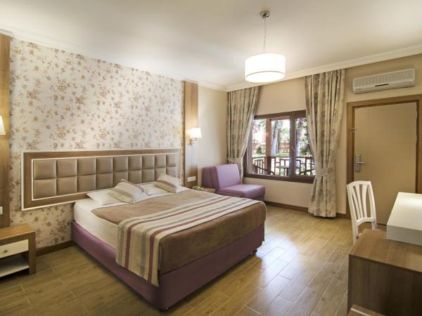 Kustur Club Holiday Village - All Inclusive : photo 3 de la chambre chambre double ou lits jumeaux - vue sur jardin