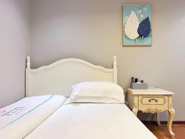 广州沃家国际公寓 : photo 6 de la chambre chambre triple - vue sur ville