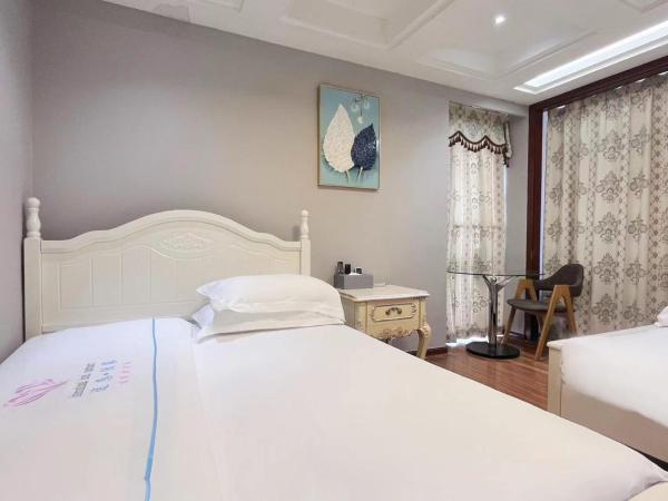 广州沃家国际公寓 : photo 8 de la chambre chambre triple - vue sur ville