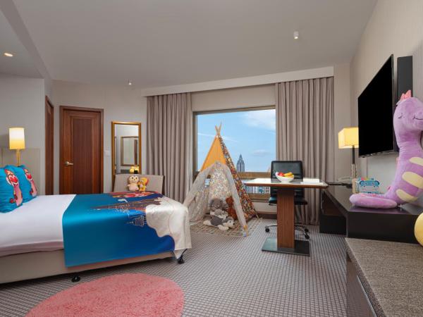 Jinling Hotel : photo 1 de la chambre jinling tower cozy twin family room