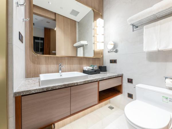 Sha Zhi Ye Serviced Apartment Hotel - Houjie Wanda Plaza Liaoxia Subway Station : photo 4 de la chambre chambre lit king-size deluxe