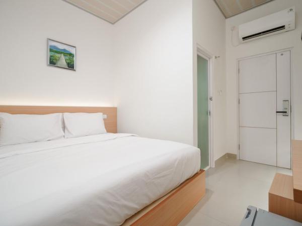 Urbanview keTemon Hotel & Resto YIA by RedDoorz : photo 3 de la chambre chambre lits jumeaux