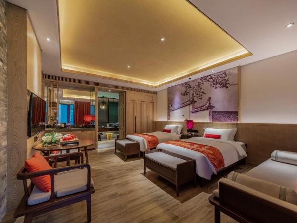Shenzhen OCT Gankeng Ancient Town Phoenix Hakka Hotel : photo 1 de la chambre chambre lits jumeaux deluxe