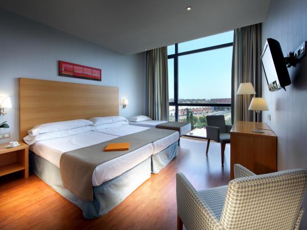 Exe Sevilla Palmera : photo 1 de la chambre chambre triple