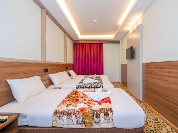 Tanha Hotel : photo 8 de la chambre chambre quadruple