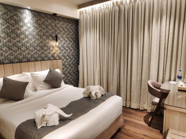 Maxxvalue Hotel MIDC - Andheri : photo 7 de la chambre chambre lit king-size deluxe