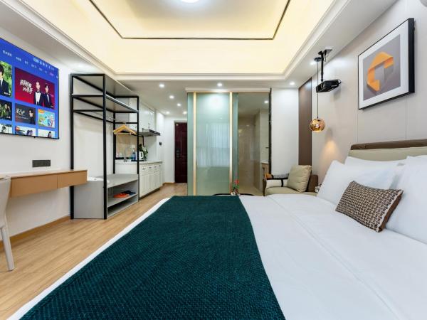East Maple International Apartment - Guangzhou Luogang Wanda Plaza Suyuan Metro Station : photo 1 de la chambre chambre lit queen-size deluxe