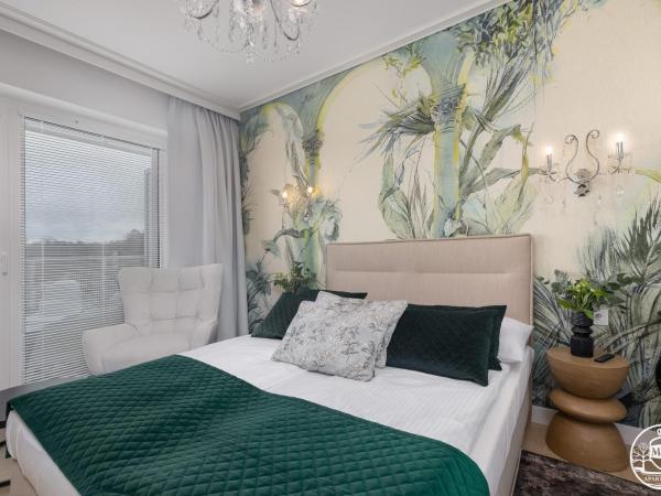 Polanki Aqua - Aquapark, Free Parking, Apartments M&M Kołobrzeg : photo 9 de la chambre deluxe apartment with air conditioninig and beach equipment