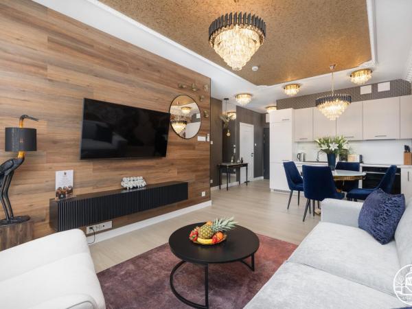 Polanki Aqua - Aquapark, Free Parking, Apartments M&M Kołobrzeg : photo 10 de la chambre deluxe apartment with air conditioninig and beach equipment