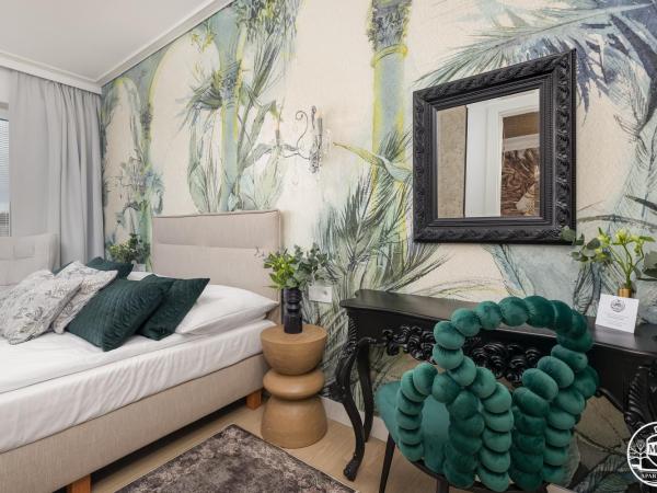 Polanki Aqua - Aquapark, Free Parking, Apartments M&M Kołobrzeg : photo 4 de la chambre deluxe apartment with air conditioninig and beach equipment